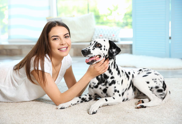 Young woman with her dalmatian.